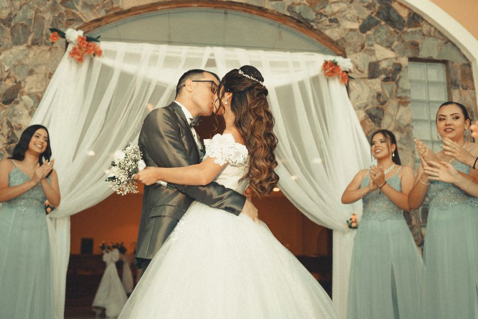 Wedding ceremony first kiss with romantic lighting
